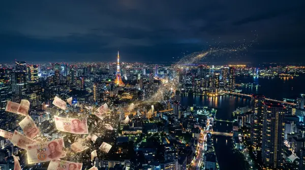 Tokyo skyline at night with fading silhouettes of Chinese yuan banknotes overlaid